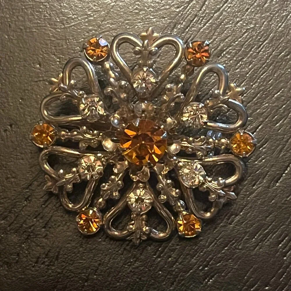 Vintage Gold Tone Starburst Brooch with Amber Topaz and Clear Rhinestones